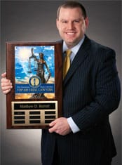 Matthew D. Barrett pictured with National Lawyers Plaque